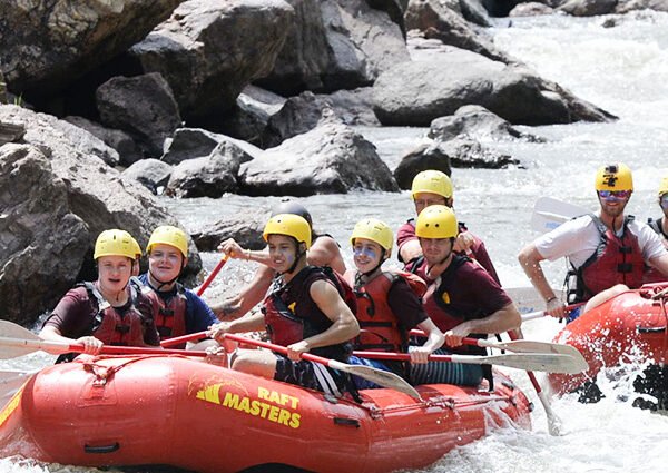  Adventurous people excited for white water rafting.