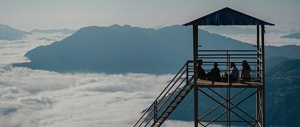 Traveller sightseeing above the clouds in Sarangkot
