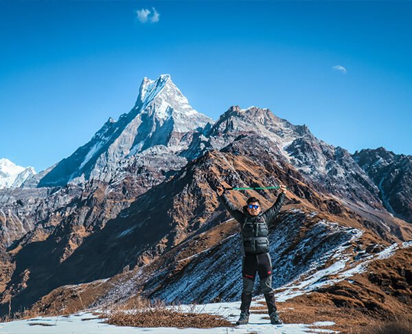 Elevate Trek - Young trekker with Mardi Himal and Machhapuchre peaks in the background