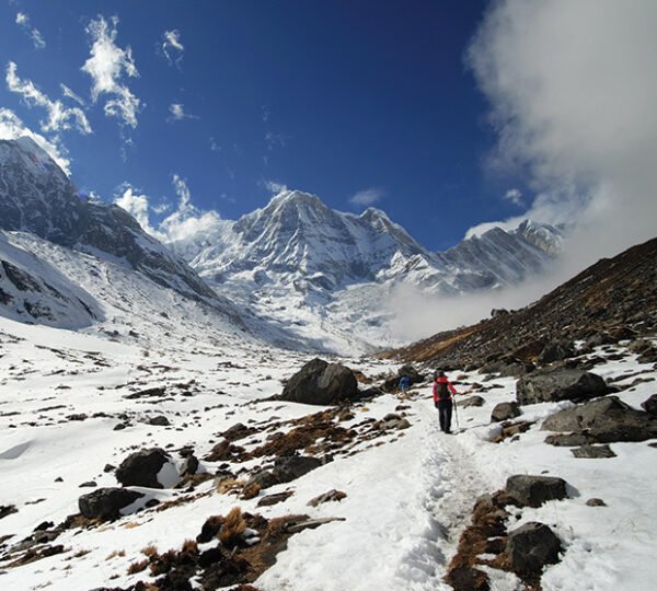 Elevate Trek- Two Trekkers walking on trail of Himalayas