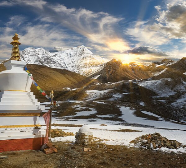 Elevate Trek-Stupa on snowy mountains in the Annapurna Region