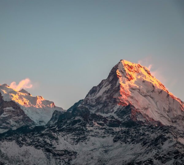 Elevate Trek: Sunrise over the majestic peaks of South Annapurna in Poon Hill Trek
