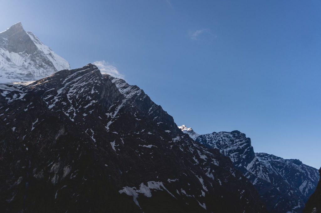 Breathtaking view of snow-capped Machapuchare mountain at sunrise in Nepal.