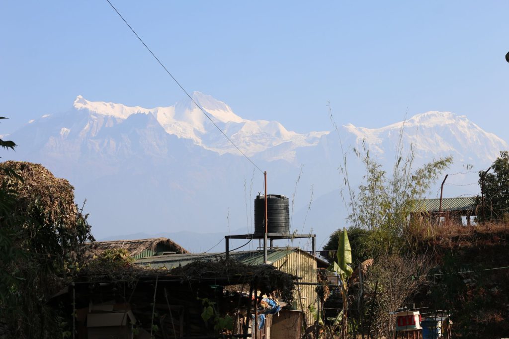 Beautiful view of snowy Annapurna peaks from a rural village in Nepal.