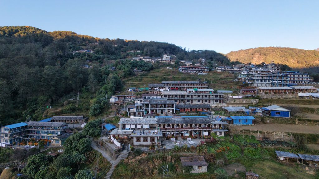 Aerial shot of traditional Ghandruk village nestled in the hills of Nepal, showcasing cultural architecture.