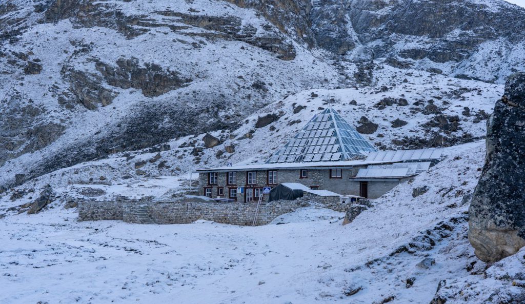 A picturesque lodge nestled in a snow-covered mountain setting, showcasing winter's serenity.