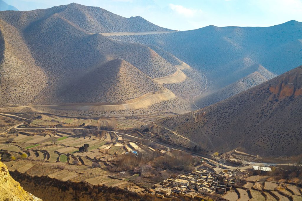 Stunning view of the hills and terrains of Upper Mustang, showcasing the unique geography and traditional settlement.