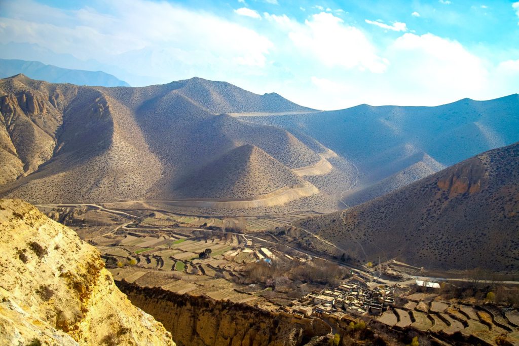 Breathtaking landscape of Lo Manthang, Nepal, showcasing rolling hills and valleys.