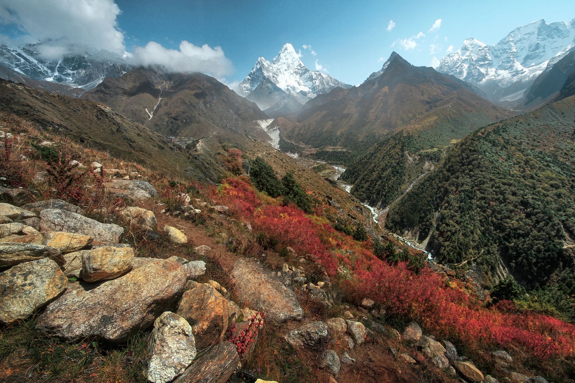Breathtaking view of the Himalayas with vibrant autumn colors and towering peaks in Nepal.